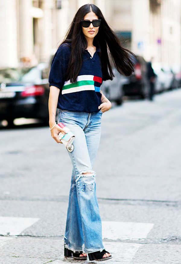 street style com camisa polo usada com calça jeans