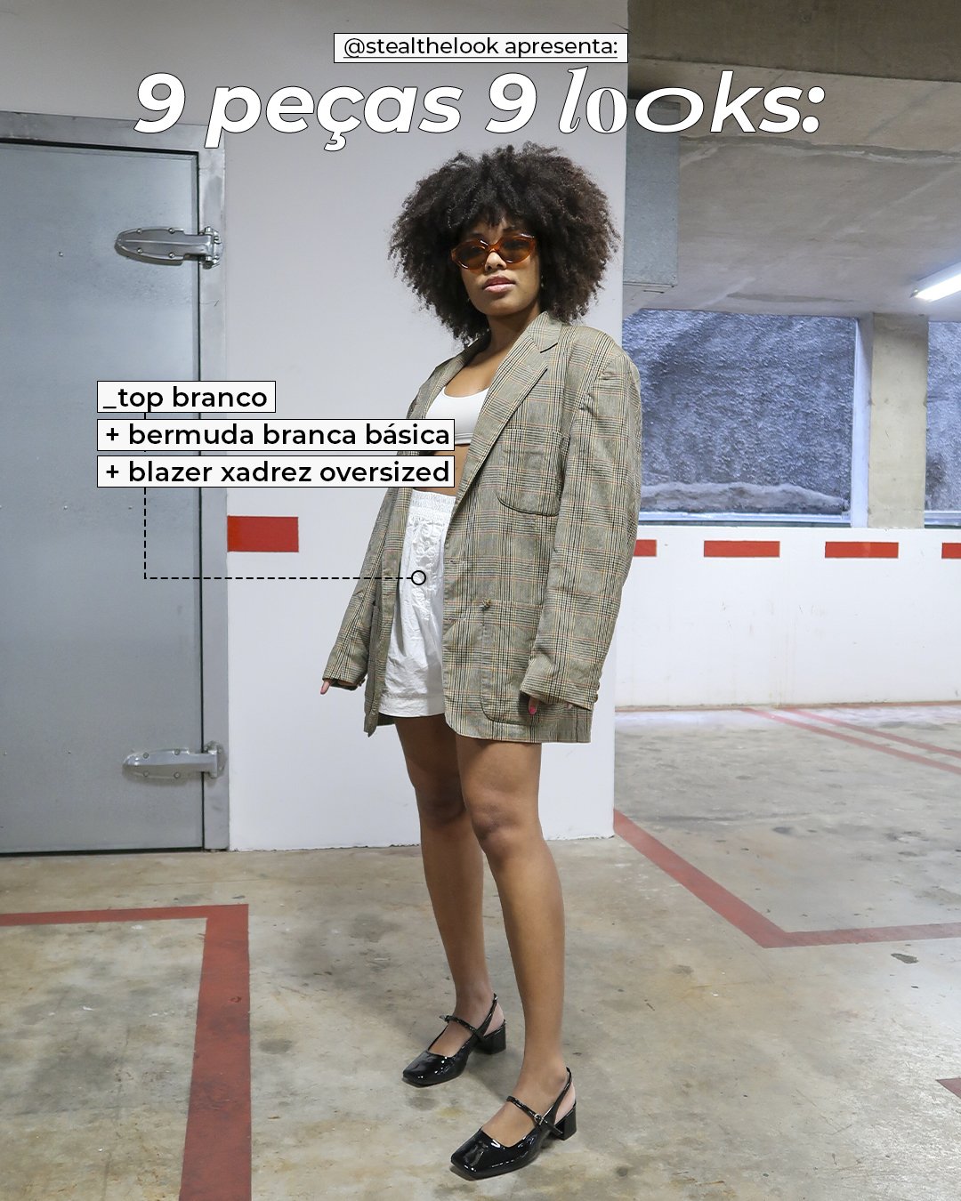 Clau Ribeiro - bermuda branca, top e blazer oversized xadrez - looks básicos - inverno - mulher negra em pé parada em uma garagem - https://stealthelook.com.br