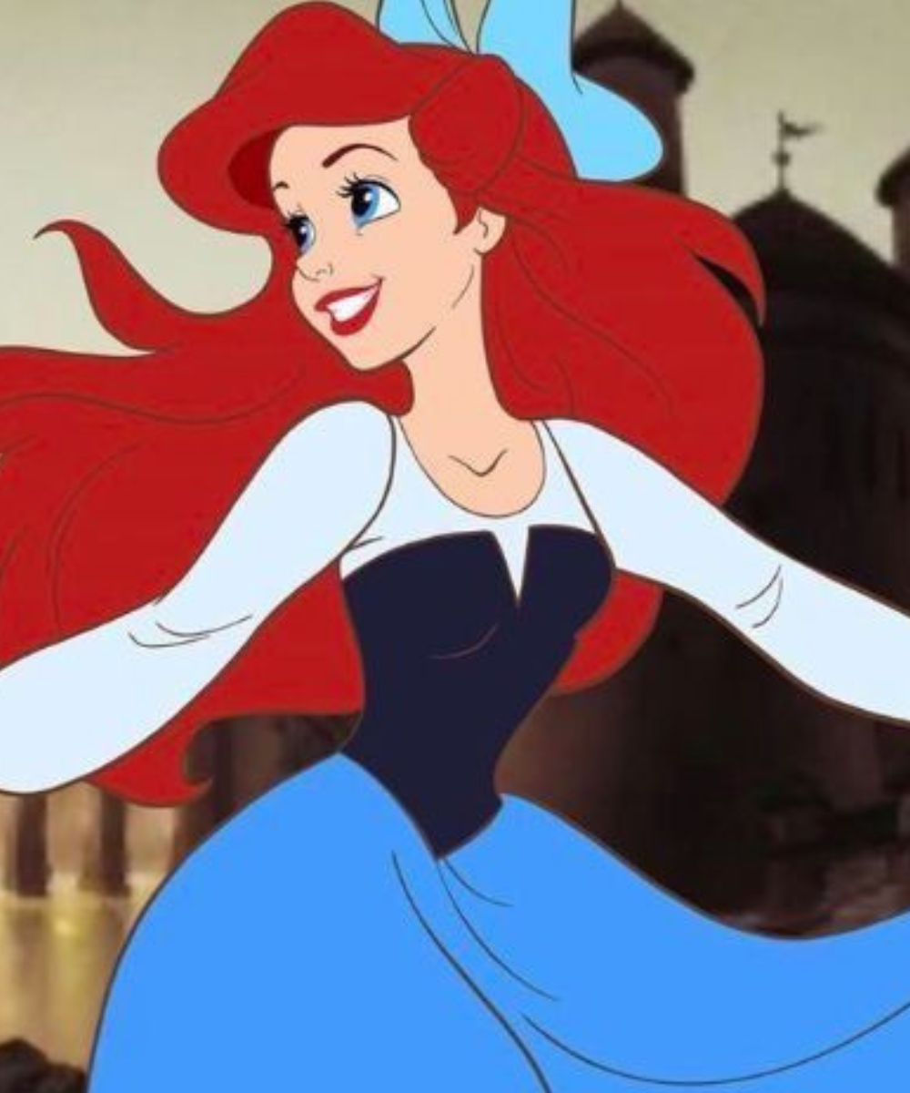 Personagem de cabelos vermelhos e vestido azul claro, parte das princesas da Disney.