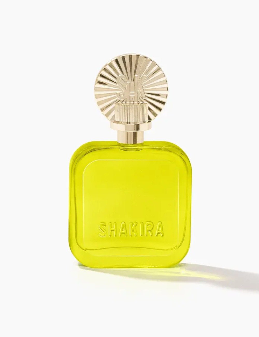 Fragrância em frasco amarelo vibrante com tampa dourada texturizada e design elegante que destaca luxo e modernidade.