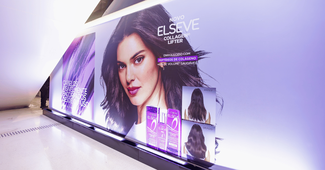 Futuro da beleza em painel lilás com modelo posa de branco e cabelo solto. Texto: NOVO ELSEVE COLLAGEN LIFTER