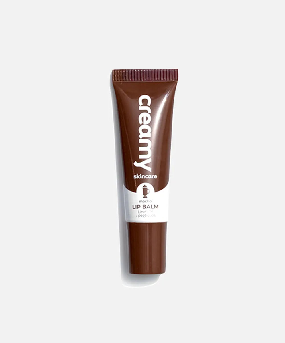Gloss de chocolate em bisnaga marrom minimalista sobre fundo claro. Texto: Creamy skincare mocha LIP BALM Linet + peptídeos